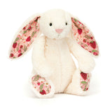 Plush bunny toy with strawberry pattern on a white background