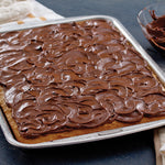Doughmakers Sheet Cake Pan with sheet cake in it