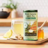 Picture Republic of Tea Honey Ginseng Green Tea Can with it made as ice tea, slice of lemon, and honey jar and honey dipper
