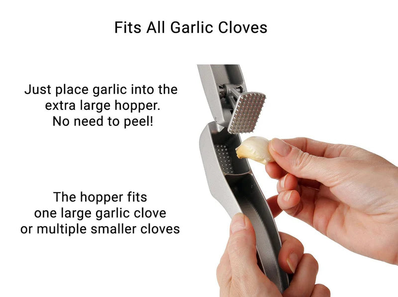 Zyliss Susi 3 Garlic Press- Caption reads, "Fits All Garlic Cloves-just place garlic into the extra large hopper. No need to peel! The hopper fits one large garlic clove or multiple smaller cloves."