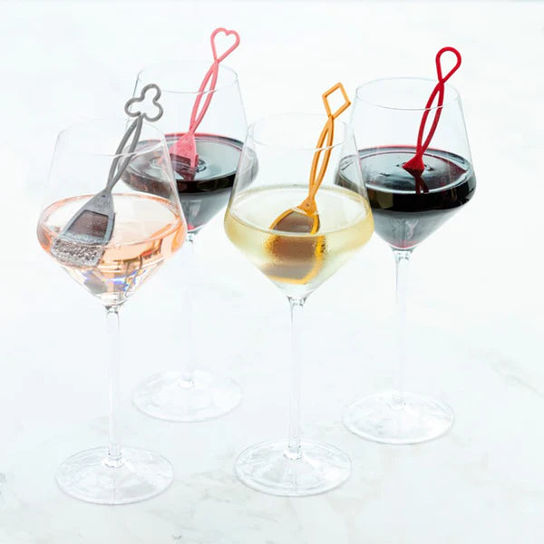Picture of 4 different types of wine in 4 different glasses with each glass of wine containing  The Wand™
