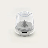 Clear and white kitchen appliance on a light gray background