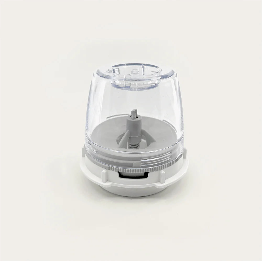 Clear and white kitchen appliance on a light gray background