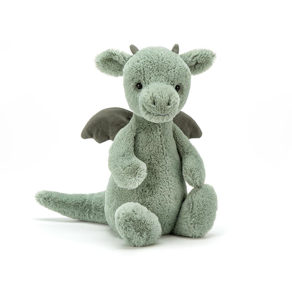 A green plush toy dragon on white background
