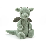 A green plush toy dragon on white background