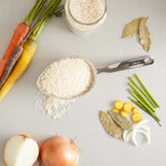 Oval one cup scoop with rice on counter
