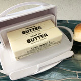 White Butterie Butter Dish holding two sticks of butter