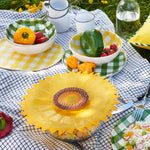 Charles Viancin Sunflower Lid covering a dish on a picnic table