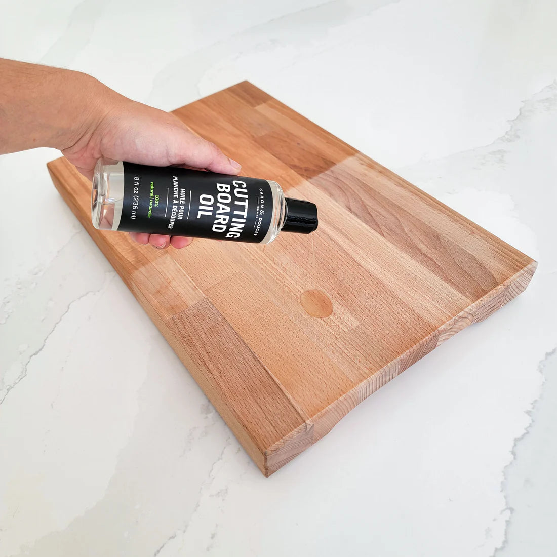 Applying Caron & Doucet Cutting Board Oil on cutting board