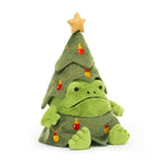 Plush toy frog with a grumpy face dressed as a Christmas tree with lights and a star on a white background