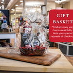 Gift basket on a wooden cutting board with a store setting in the background