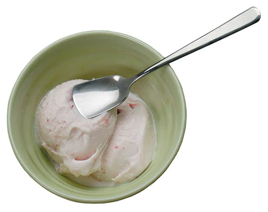 Ice cream spoon in a dish of ice cream