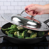 Picture of someone putting lid on top of a pan of broccoli