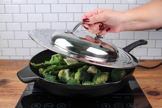 Picture of someone putting lid on top of a pan of broccoli