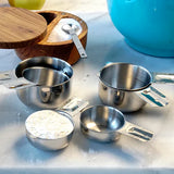 Stainless Steel Measuring Cups on counter with ingredients