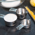 Stainless Steel Measuring Cups on counter with ingredients