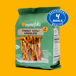 Momofuku Tingly Chili Noodles packaging on a yellow background with a '4 Meals Quality' badge.
