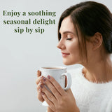 Woman enjoying a cup of tea with caption that says "Enjoy a soothing seasonal delight sip by sip"