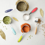 Measuring cups filled with Lentils and spices