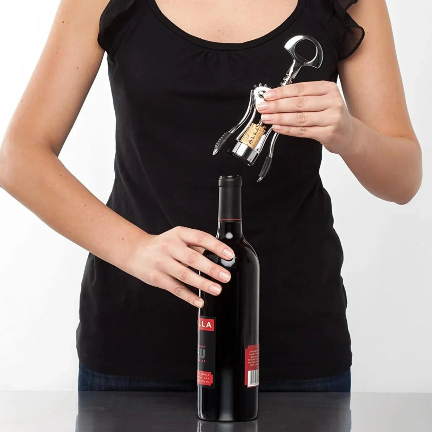 Zyliss Winged Corkscrew removing cork from wine bottle