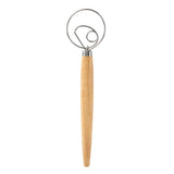 Danish Whisk with wooden handle and metal head on a white background