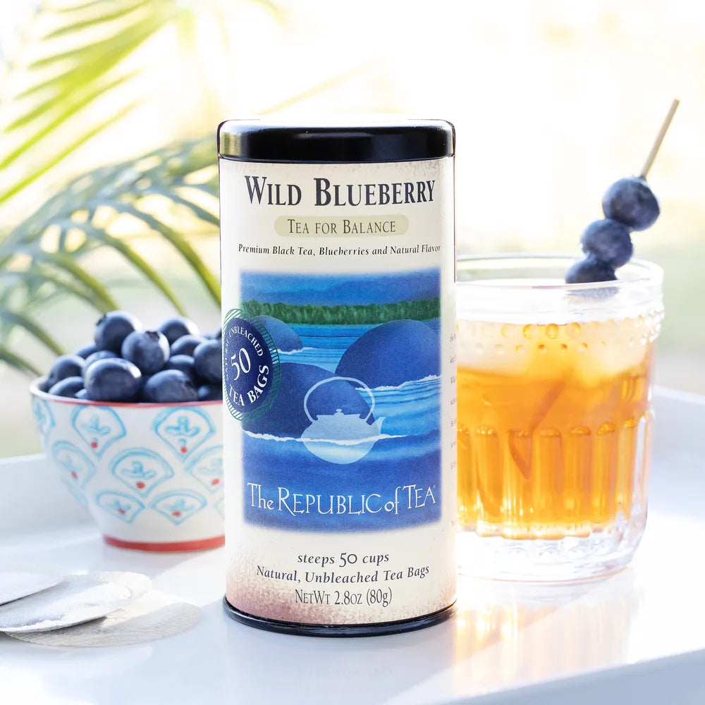 Republic of Tea's Wild Blueberry tea, glass of ice tea with blueberries, a cup of blueberries