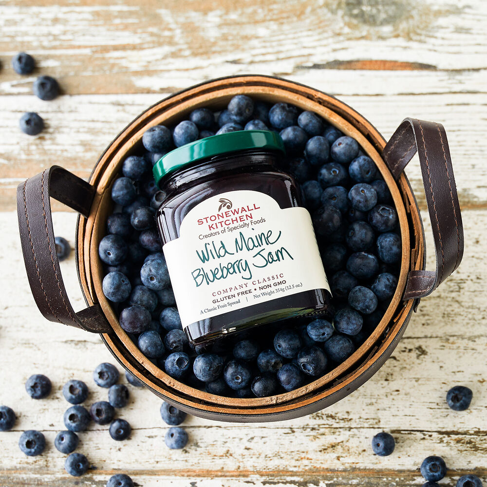 Stonewall Kitchen's Wild Maine Blueberry Jam in a basket of blueberries