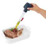 Zyliss 2-in-1 Baster & Infuser marinating a piece of meat