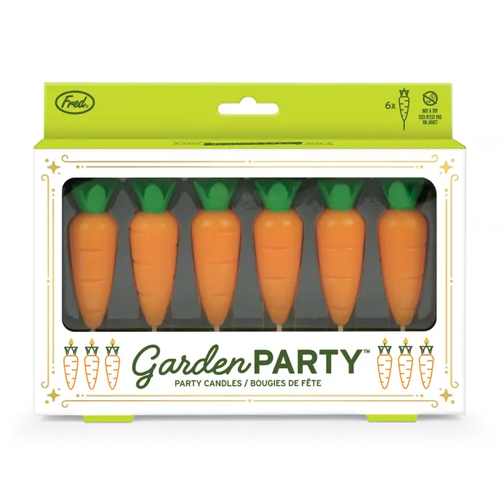 Packaging of 'Garden Party' carrot-shaped candles with a green and white design.
