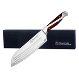 Serrated knife with wooden handle and Hammer Stahl branding on a white background