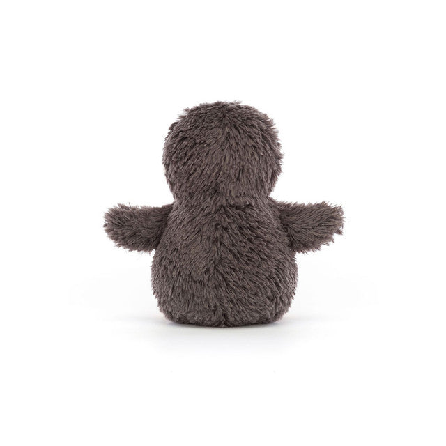Plush toy penguin on a white background