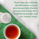 A cup of tea, tea bags and the words  "These teas are naturally decaffeinated using an environmentally-friendly process that leaves their healthful properties and rich flavors intact.