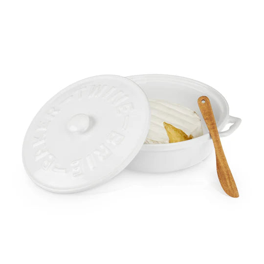 Twine Ceramic Brie Baker with open lid, wood spreader, and piece of  brie in baker