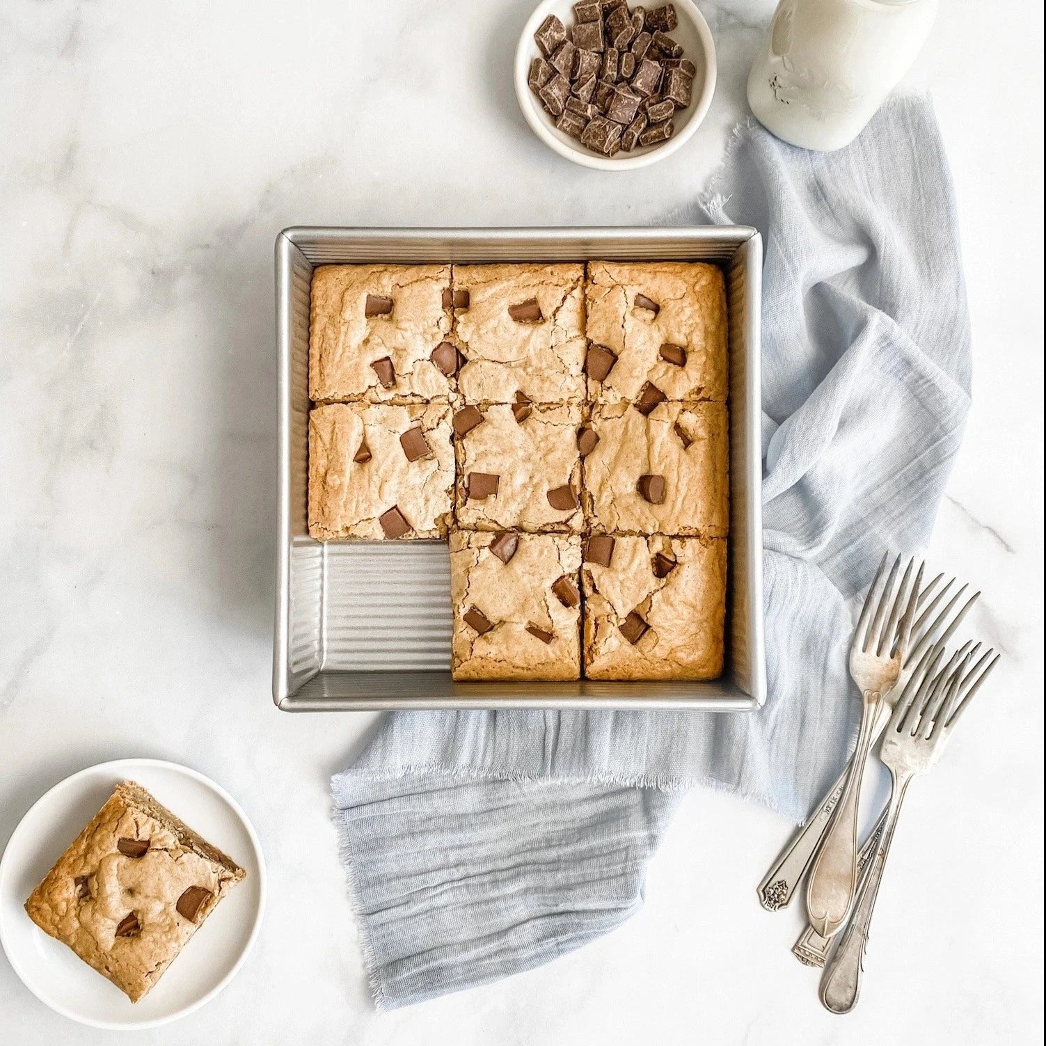 USA 8 inch square pan with chocolate chip cookie bars in it