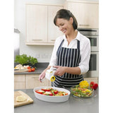 Woman using Zyliss Classic Cheese Grater over a salad