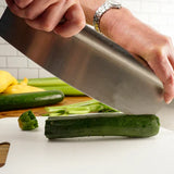 Pizza cutter cutting cucumber