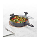 Zyliss 11 ing Forged Aluminum Saute Pan with lid being used to saute vegetables