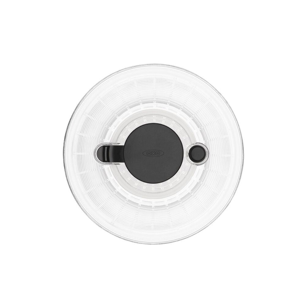 Round white salad spinner top with black center on a white background