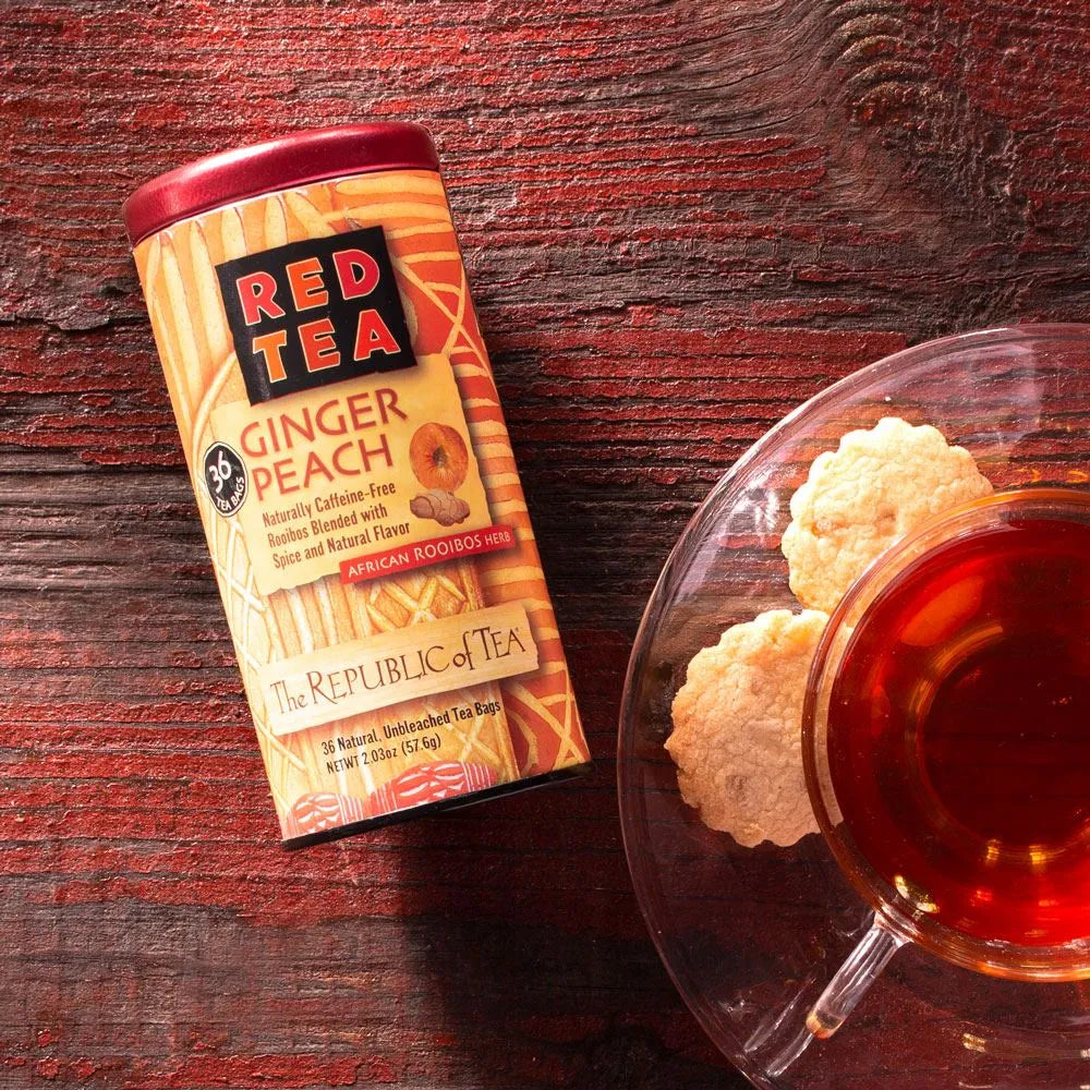  Picture Republic of Tea Ginger Peach Red Tea Can with cookies and a cup of tea
