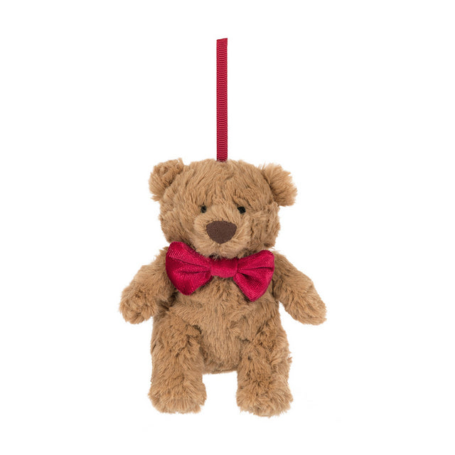 Plush teddy bear with a red bow tie on a white background