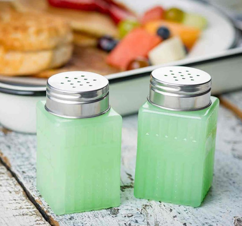 Jadeite 2 oz salt and pepper shakers in front of a meal