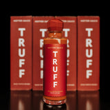 Truff Hotter Sauce Bottle with Truff Boxes in the background