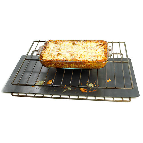 Chefs Planet Commercial Oven Liner protecting the bottom of the oven from cooking a lasagna that has spilled over