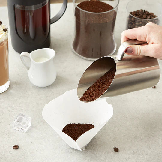 Scoop and Measurement scoop with coffee grounds