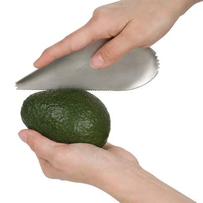 Trudeau Avocado Tool cutting open an avocado