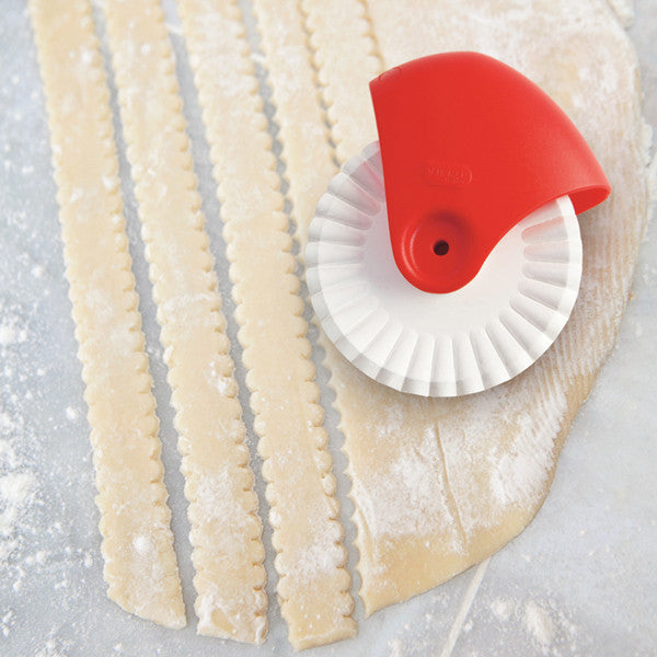 Talisman Pastry Cutter with strips of dough