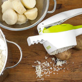 Potato ricer with bits of potato