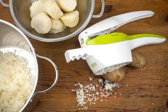 Potato ricer with bits of potato