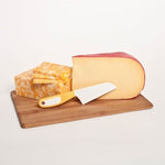 The Cheese knife with a block of cheese