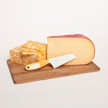 The Cheese knife with a block of cheese